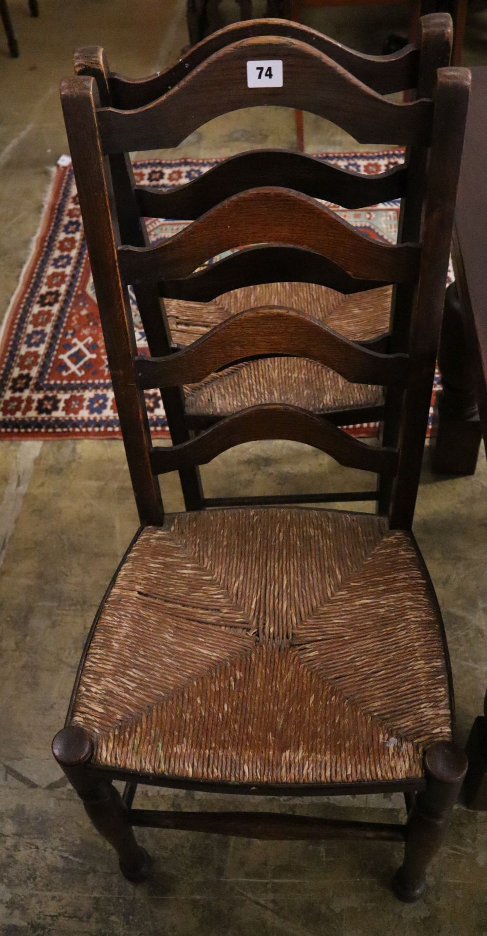 A pair of 19th century ladder-back oak chairs with rush seats